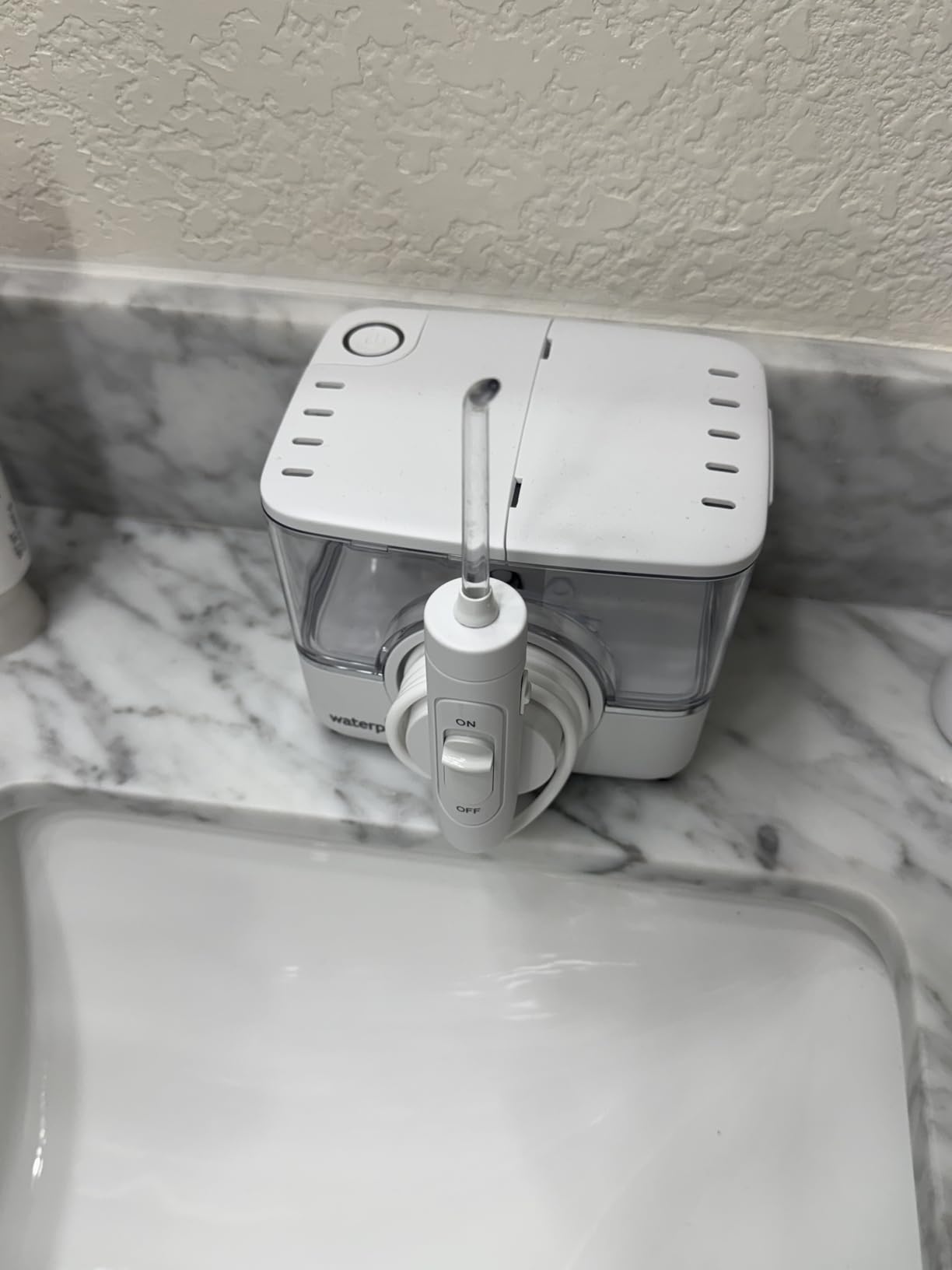Waterpik ION Professional Water Flosser, Rechargeable and Portable for Teeth, Gums, Braces, 10 Settings, 7 Flossing Tips For Multiple Users And Needs, ADA Accepted, WF-12 White, Packaging May Vary customer photo 1