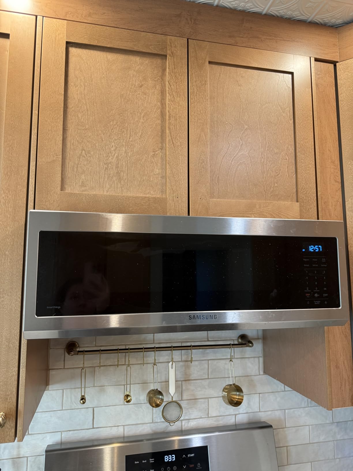 Samsung 1.1 Cu Ft Smart SLIM Over the Range Microwave Oven w/ 550 CFM Hood Vent, Wi-Fi, Voice Control, LED Light Bar, Sensor Cook, 1100 Watt, ME11A7710DS/AA, Fingerprint Resistant Stainless Steel customer photo 1