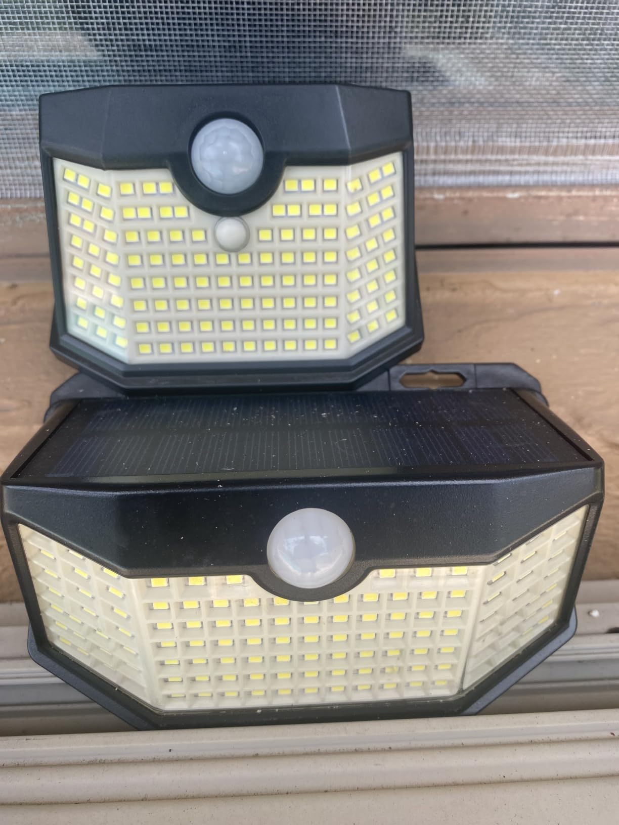 HMCITY 120 LED Outdoor Solar Lights with Motion Sensor and 3 Lighting Modes, IP65 Waterproof Wide Solar Wall Lights Ideal for Garden Patio Yard (Front Button 6Packs, Black Shell-Daylight White) customer photo 1